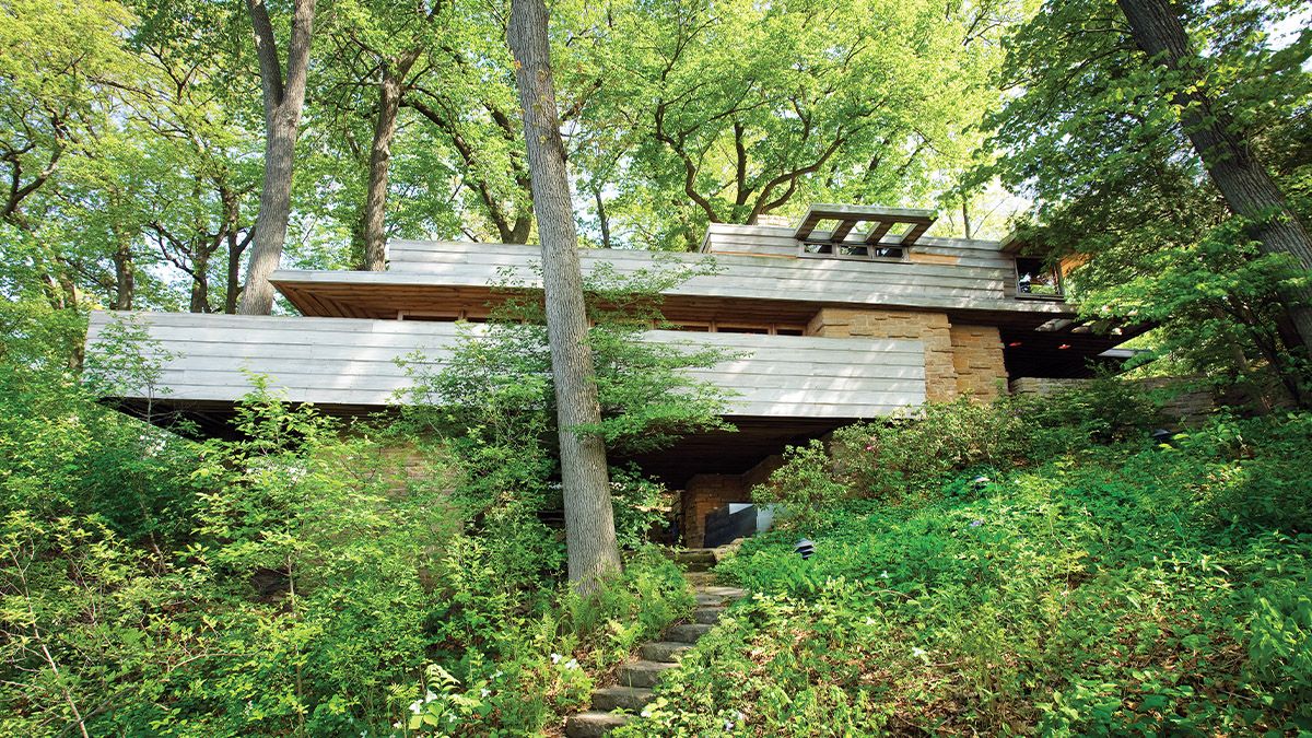 Photo of Frank Lloyd Wright's Pew House surrounded by trees.